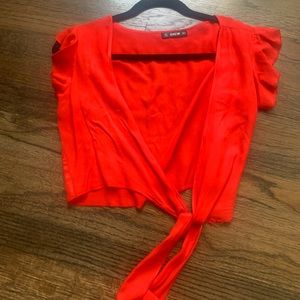 red cropped top